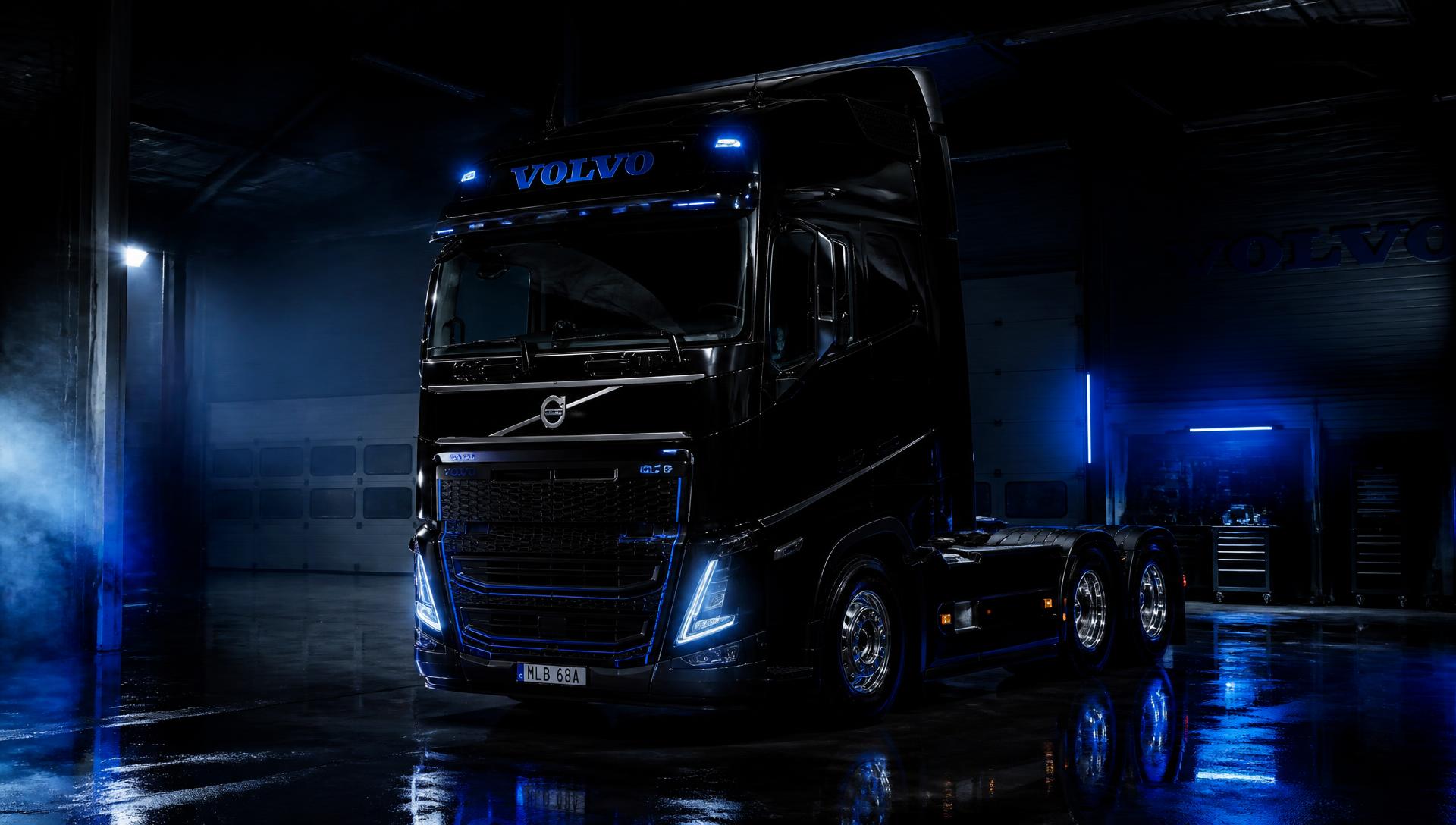Caminhão Volvo pesado em oficina mecânica escura